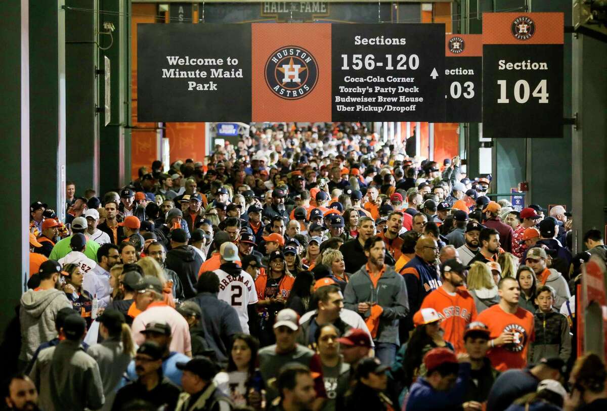 Fans navigate the concourse on the way to their seats before Game 7 of the World Series at Minute Maid Park on Wednesday, Oct. 30, 2019, in Houston.