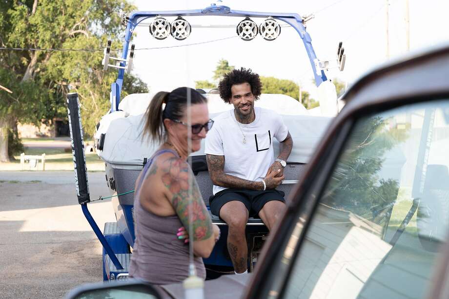 Willie Cauley-Stein has a  laugh with his mother, Marlene Stein, at his childhood home in Spearville, Kan. on August 2, 2019. Golden State Warriors Center Willie Cauley-Stein grew up in Spearville, Kan. Photo: Adam Shrimplin / Special To The Chronicle