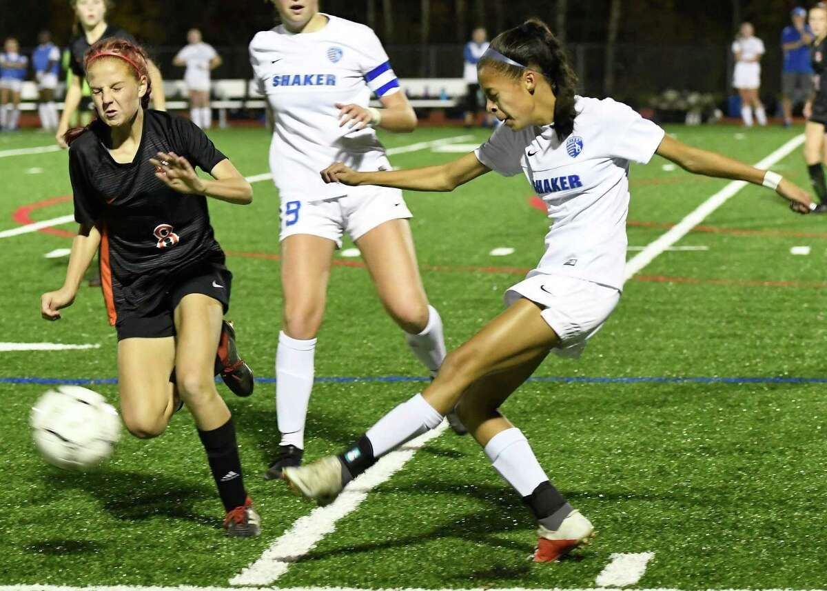 Shaker's Mayah Wheeler kicks the ball from Bethlehem's Casey Holstein during their Class AA semifinal match on Wednesday, Oct. 30, 2019, in Mechanicville, N.Y. (Jenn March, Special to the Times Union)