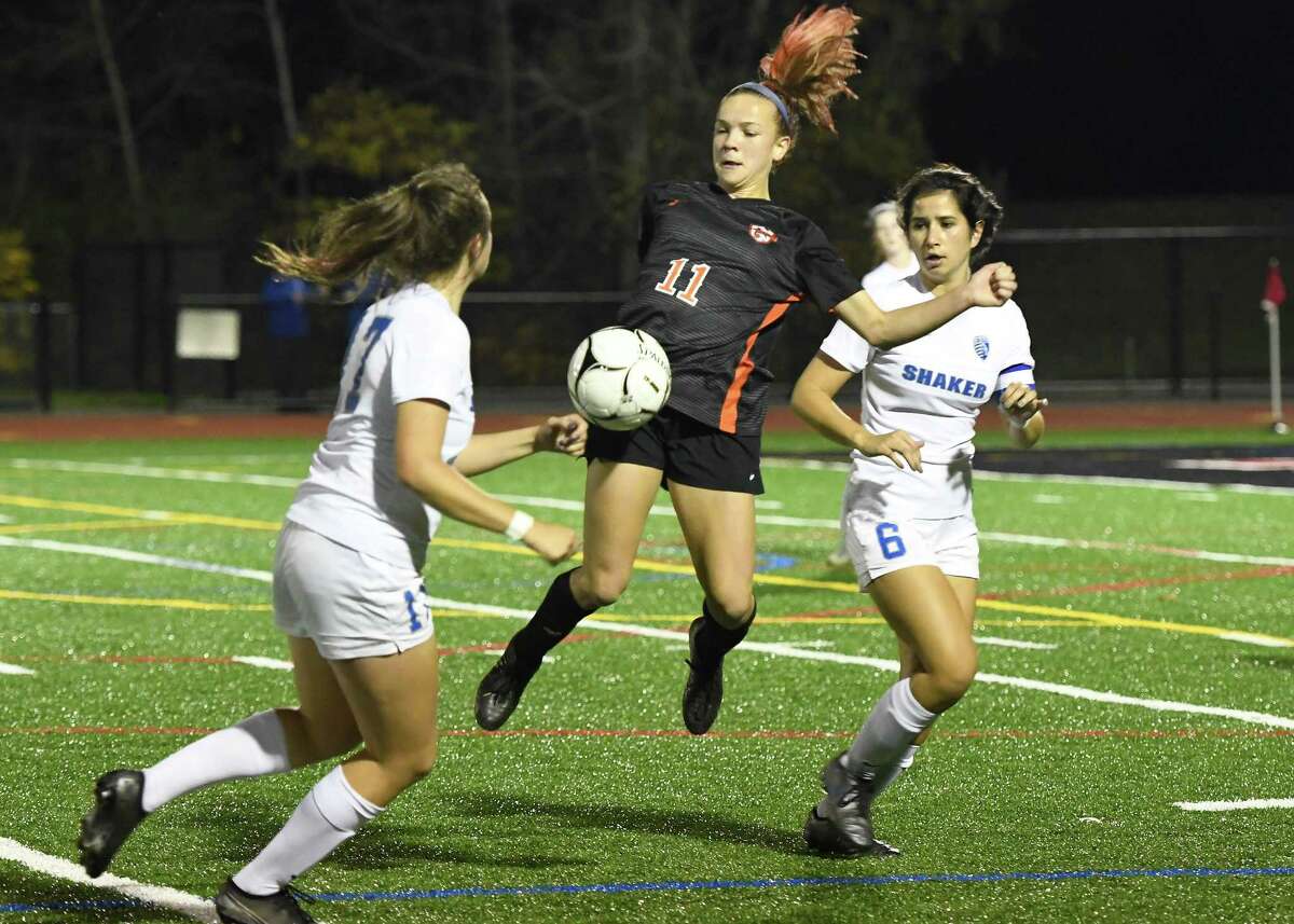 Bethlehem's Claire Hutton catches the ball on her hip as Shaker's Danielle Roemer (17) and Rachel Dentinger (6) look on during their Class AA semifinal match on Wednesday, Oct. 30, 2019, in Mechanicville, N.Y. (Jenn March, Special to the Times Union)