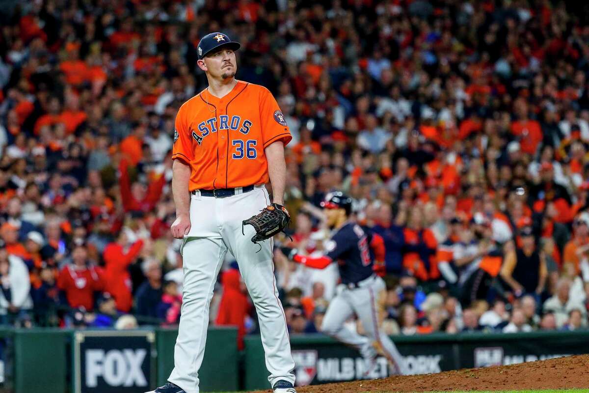 Astros relief pitcher Will Harris (36) reacts after giving up a two-run home run to Nationals designated hitter Howie Kendrick.