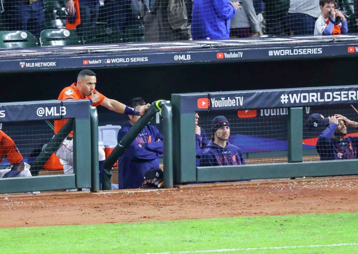 Houston Astros shortstop Carlos Correa (1) watches from the dugout at the end of Game 7 of the World Series at Minute Maid Park on Wednesday, Oct. 30, 2019, in Houston.