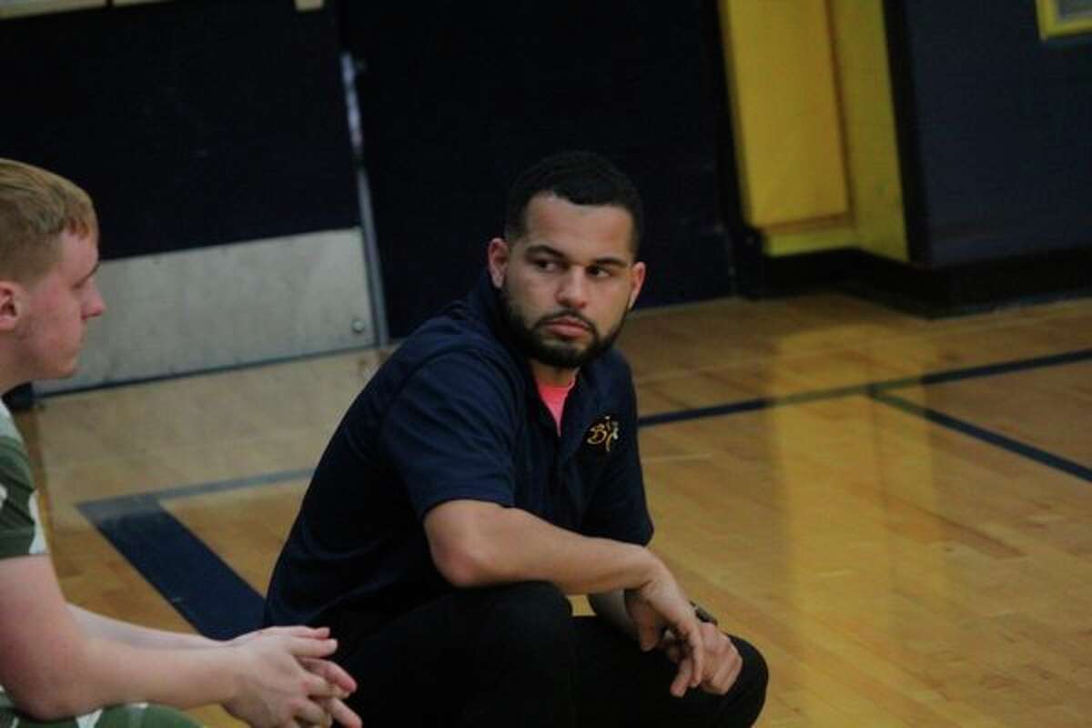 Baldwin volleyball coach Duane Roberts confers with assistant Jesse Pancio during a match. (Star file photo)