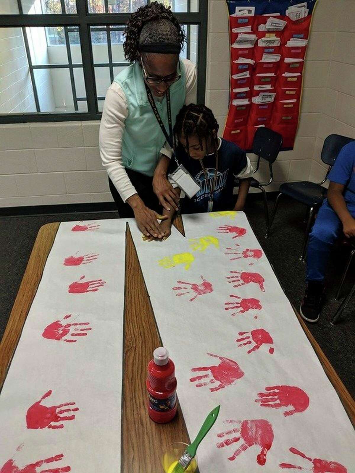 With help from teachers Abbey Braidwood, Nicole Day, Tanya Scales, Diane VanAntwerp and Karen Knapp, Baldwin Elementary School students created new artwork to decorate the school's hallways. Each student had the chance to add their hand print to the design, making a dedicated effort to "be the 'I' in kind." (Courtesy photos)