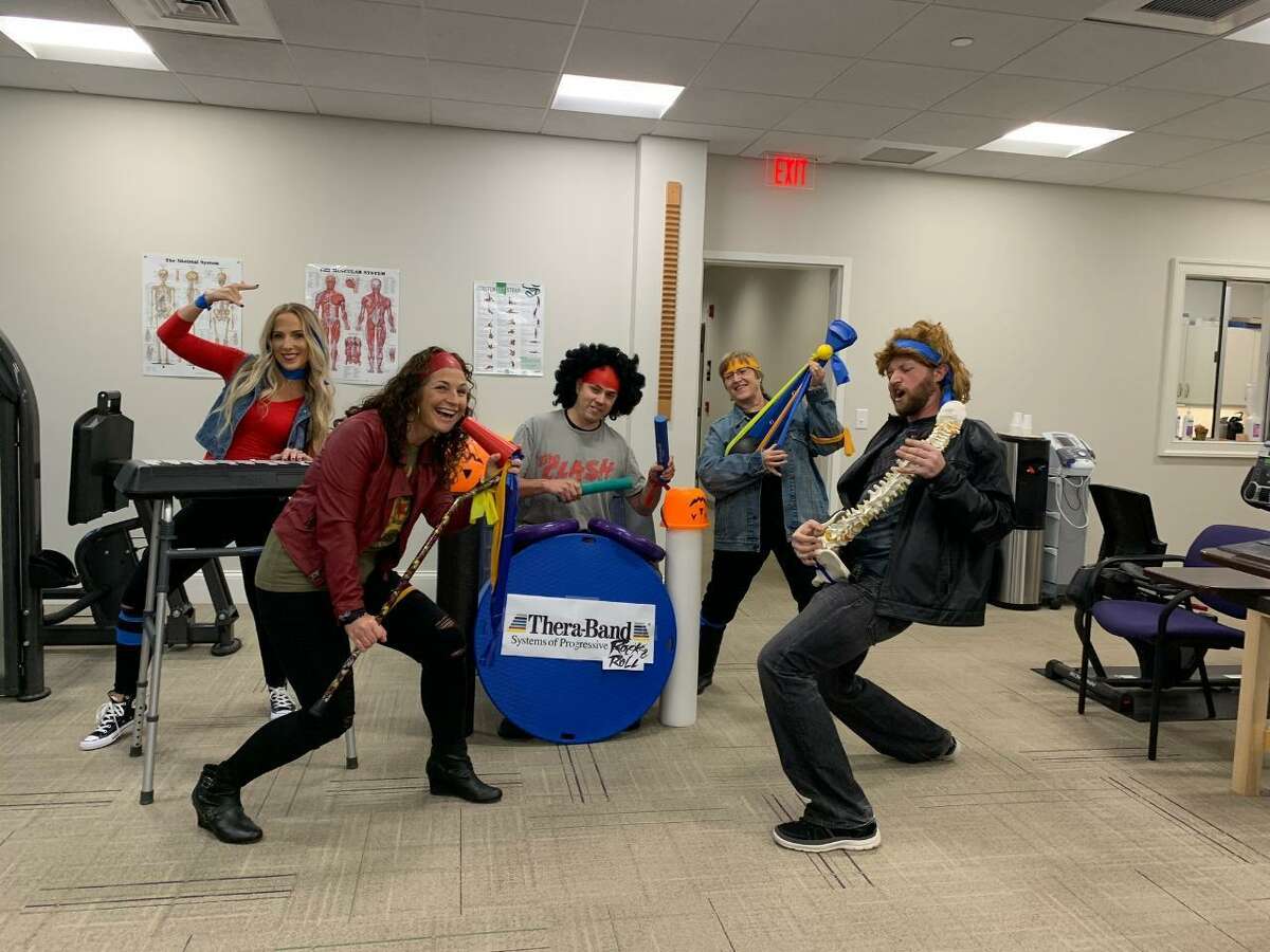 Greetings and Happy Halloween from the team at RVNAhealth Rehabilitation & Wellness Center, aka The Therabands. Yes, they're all practicing clinicians, but that doesn't mean that they can't rock with the best of them. Pictured is Sarah Triano, OTR; Casey Sarmiere, MSPT; Jeff Panepento, MSPT; Peggy Marlin, Rehab Tech; and Will Rowe, PTA. Missing from the photo is Gigi Weiss, MSPT, Band Manager. Learn more at rvnahealth.org.