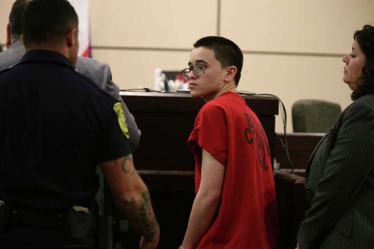 Matthew Dempsey, 18, is led out of the Bexar County 437th State District Court after pleading guilty to murder charges, Thursday, Oct. 31, 2019. Dempsey killed his mother, Mary Helen Dempsey, 53, in April of this year. Dempsey was originally charged with capital murder charges. He will receive a 42-year prison sentence after his co-defendant, Daniel Saucedo, 18, is tried. The pair are accused of killing Dempsey with a baseball bat. On the right is one of his attorneys, Monica E. Guerrero.