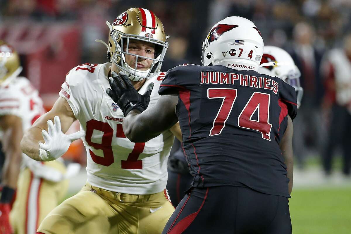 San Francisco 49ers defensive end Nick Bosa (97) blocks against Arizona Cardinals offensive tackle D.J. Humphries (74) during the second half of an NFL football game, Thursday, Oct. 31, 2019, in Glendale, Ariz. (AP Photo/Rick Scuteri)