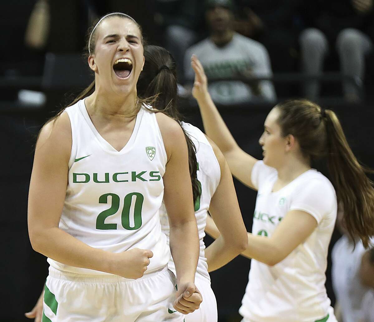 FILE - In this Tuesday, Dec. 18, 2018, file photo, Oregon guard Sabrina Ionescu (20) reacts during an NCAA college basketball game against Mississippi State in Eugene, Ore. Ionescu was named the John R. Wooden Women's Player of the year at the College Basketball Awards ceremony in Los Angeles Friday, April 12, 2019. (AP Photo/Charlie Litchfield, File)