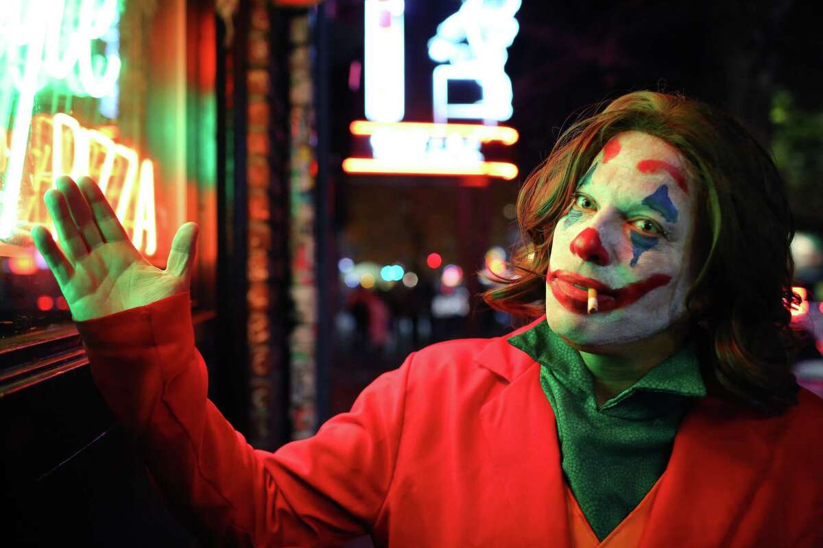 Yom Tov is dressed as The Joker for Halloween on Capitol Hill, Thursday, Oct. 31, 2019.