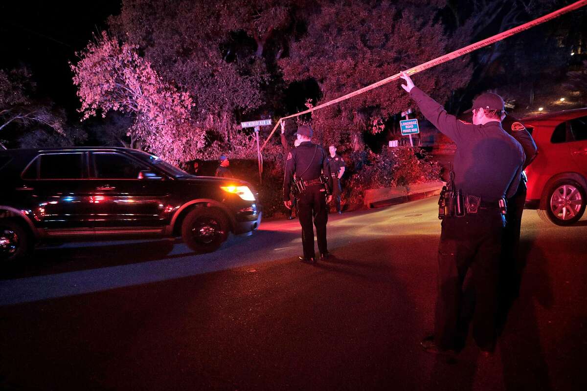 Contra Costa Sheriffs deputies hold the police tape up for investigators to drive under at the intersection of Knickerbocker Lane and Spring Road near the location where several people were shot at a Halloween party on Lucille Way in Orinda , Calif., on Friday, November 1, 2019. Early reports stated that 4 people had been killed with others injured and transported to nearby hospitals. Though several of the injuries were believed to have been caused when guests ran from the shooting.