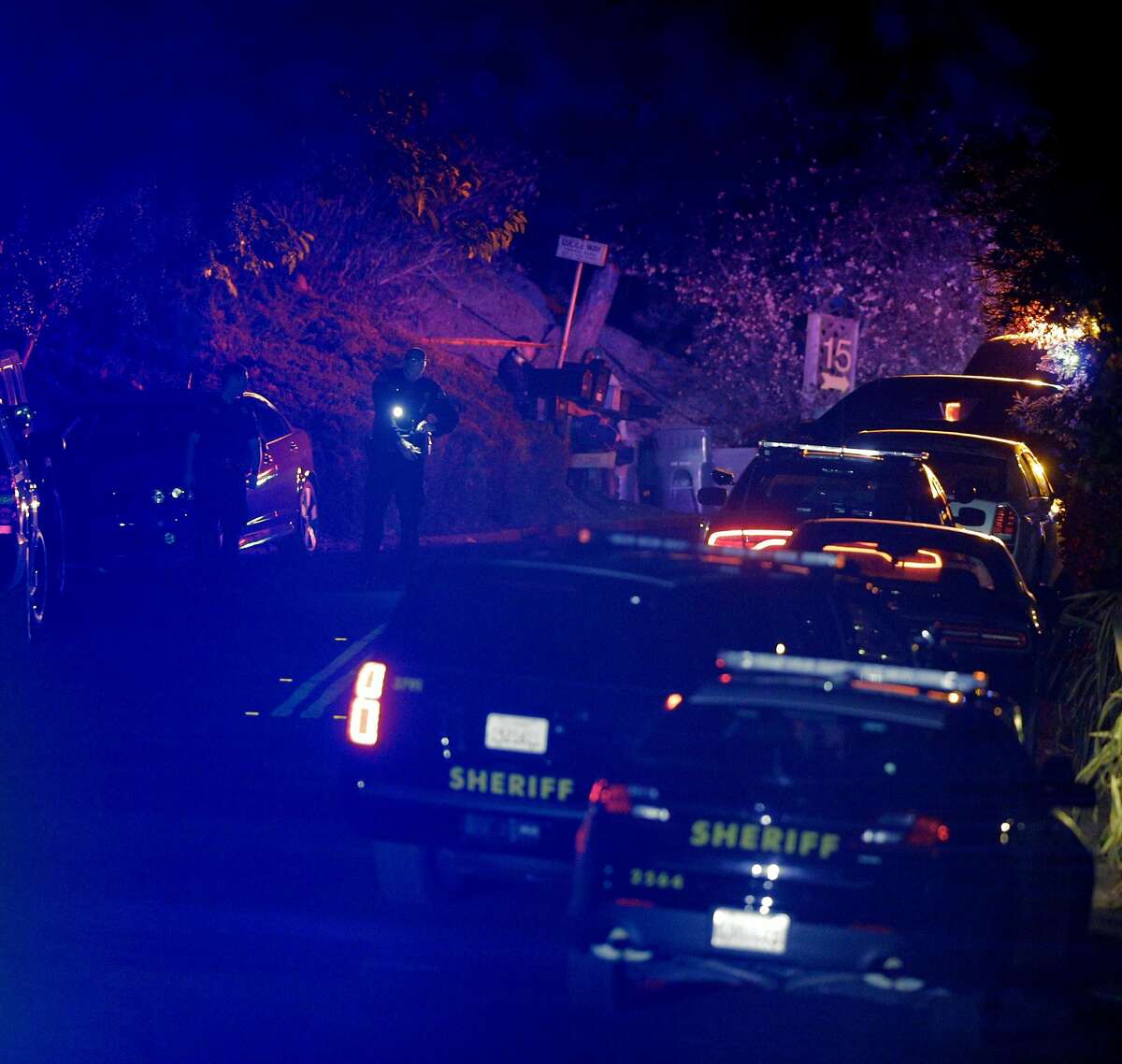 Contra Costa Sheriffs deputies walk near a crime scene on Knickerbocker Lane near the location where several people were shot at a Halloween party on Lucille Way in Orinda , Calif., on Friday, November 1, 2019. Early reports stated that 4 people had been killed with others injured and transported to nearby hospitals. Though several of the injuries were believed to have been caused when guests ran from the shooting.