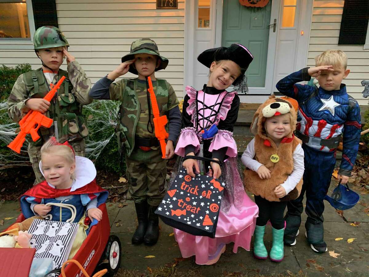 Two marines, Snow White, a pirate princess, a puppy and Captain America ready to trick-or-treat in the Westmoreland neighborhood.