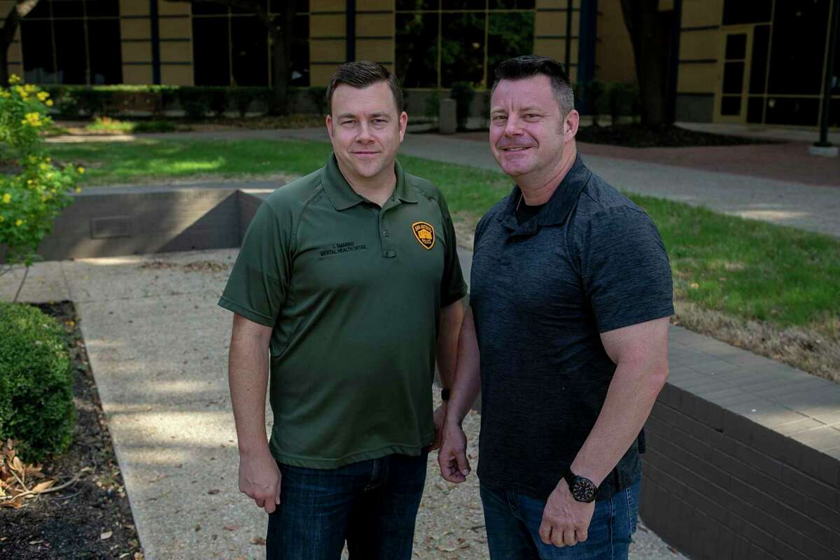 San Antonio Police Officers Joe Smarro, left, and Ernie Stevens pose at San Antonio Police Training Academy in 2019.