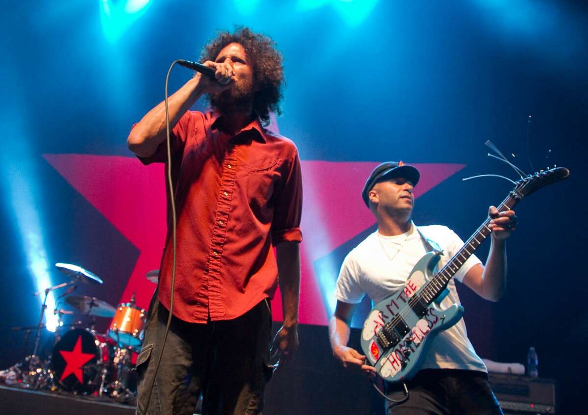 FILE - Zack de la Rocha (L) and Tom Morello of Rage Against The Machine perform at the Hollywood Palladium on July 23, 2010 in Hollywood, California. Rage Against the Machine is reportedly reuniting in 2020 and has booked tour dates in a limited number of states.