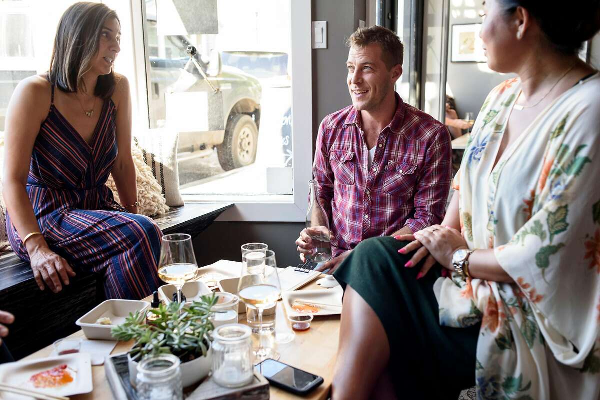 Owner and winemaker Sam Bilbro, center, chats with guests Jadine Trujillo, left, and Oakason Hoffman at Idlewild Wines tasting room in Healdsburg, Calif., on Friday June 29, 2018.