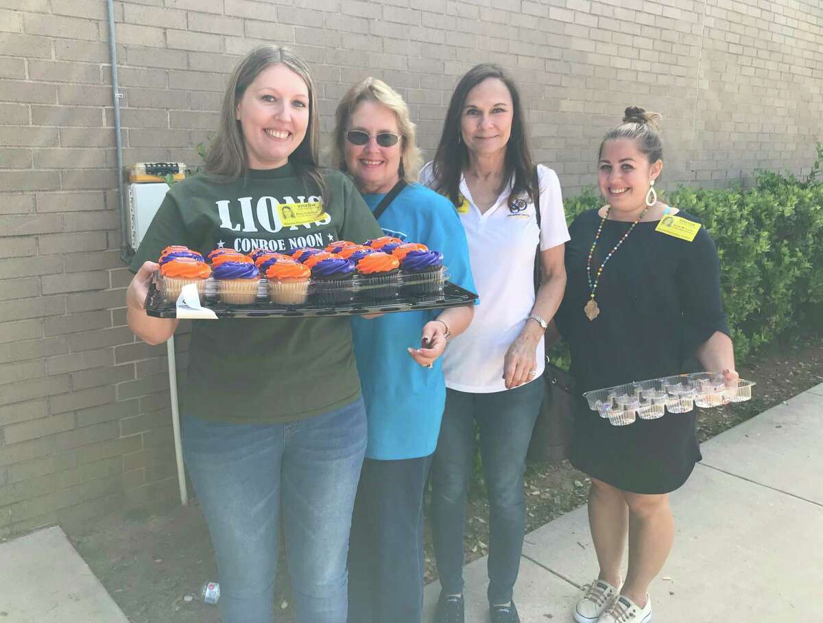 Members of Conroe Noon Lions Club played hostesses to over 250 students at their adopted school of Reaves Elementary for E-Club; handing out treats for their excellent grades and conduct during the first nine week of school. Pictured left to right are Amy Cannon, Jane Johnson, Jane Copeland, and Sarah McClure.