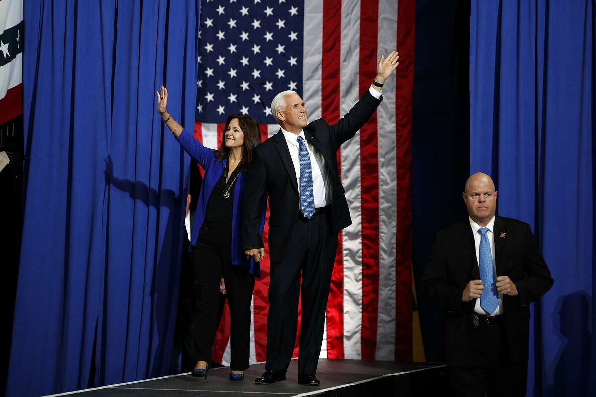 Vice President Mike Pence arrives to speak at a campaign rally at the Target Center, Thursday, Oct. 10, 2019, in Minneapolis. (AP Photo/Evan Vucci)