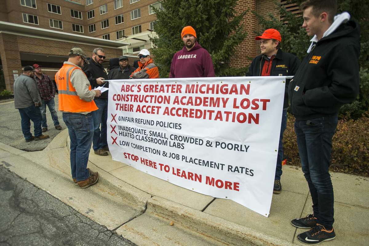 Members of local chapters of the Laborers' International Union of North America gather Friday, Nov. 1, 2019 for a protest in front of the H Hotel to bring attention to what they called an "unsafe and unaccredited training program in local high schools." Organized by the group "ABC Truth," the time and place of the protest coincided with a dinner ceremony taking place at the H Hotel, at which the Associated Builders and Contractors Greater Michigan Chapter (ABC) honored five "Champions of ABC's Trifecta." (Katy Kildee/kkildee@mdn.net)