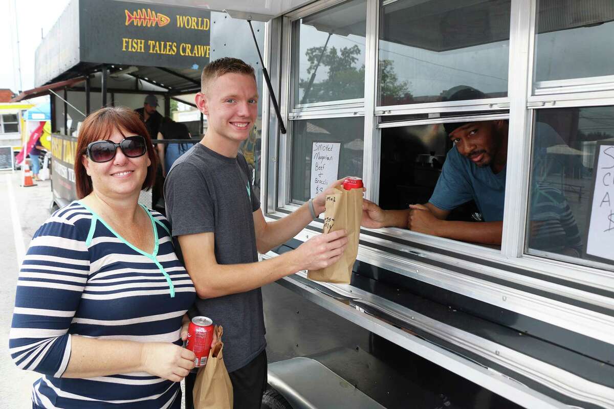 Curtis Jones of After The Game Food trailer was a regular to Food Truck Friday during the early days of the event. Tami Green and her son Austin gave thumbs up for the food.