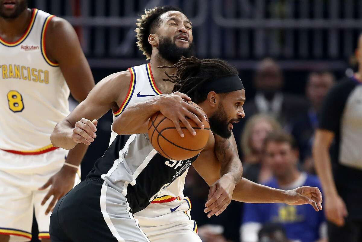 Patty Mills #8 of the San Antonio Spurs is guarded by Ky Bowman #12 of the Golden State Warriors at Chase Center on November 01, 2019 in San Francisco, California. 