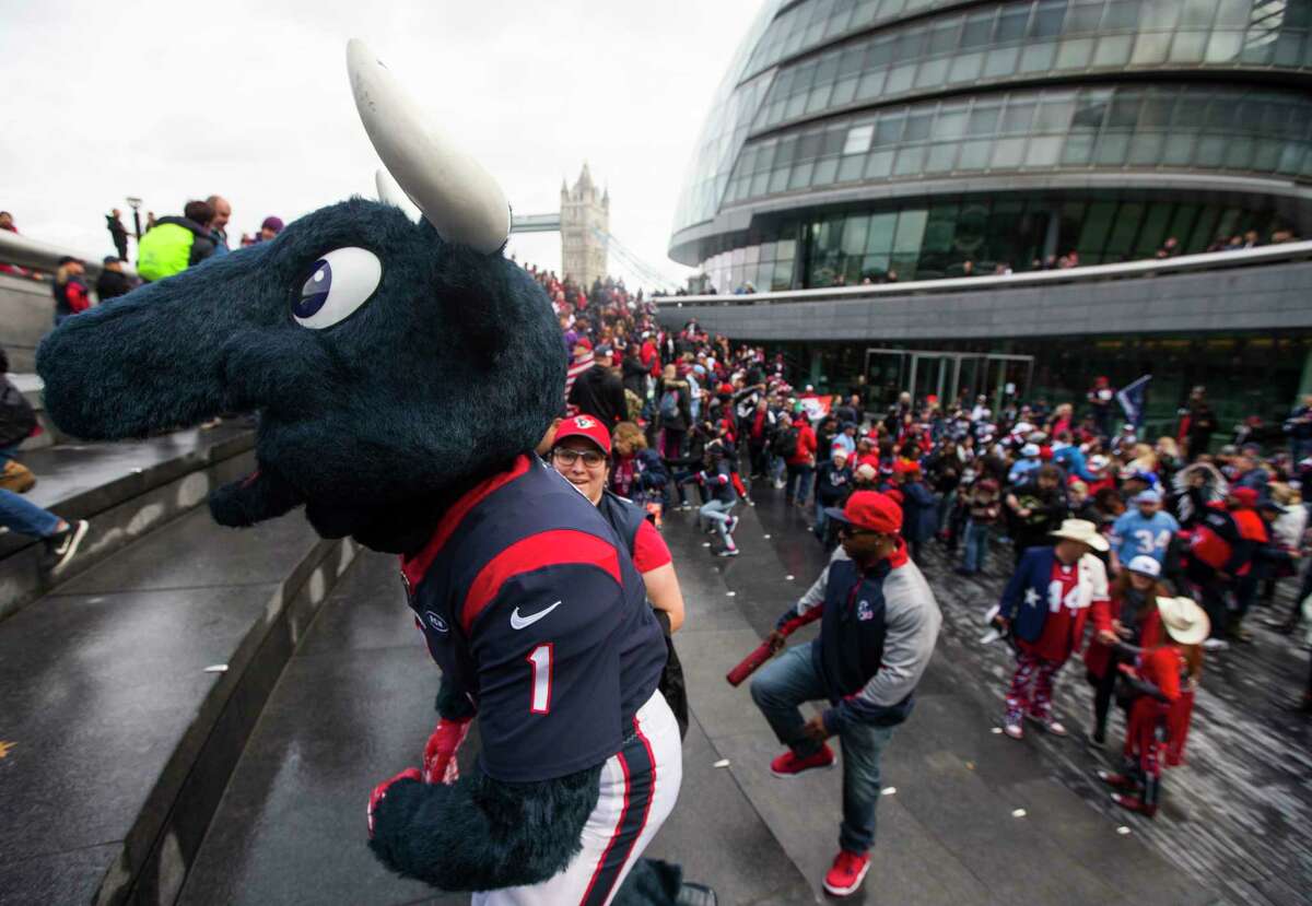 Houston Texans cheerleaders join a group of fans as they gather at More London near the Tower Bridge on Saturday, Nov. 2, 2019, in London. The Texans play the Jacksonville Jaguars at Wembley Stadium on Sunday.