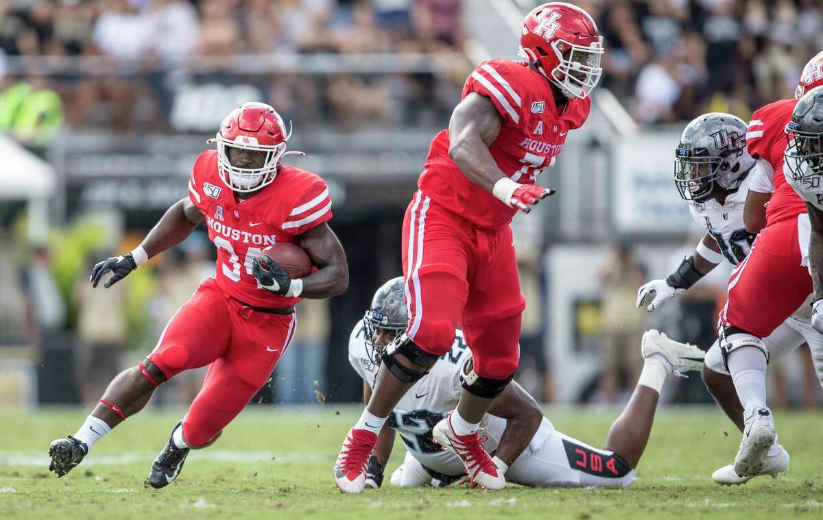 Houston running back Mulbah Car (34) runs through the Central Florida defense during the first half of an NCAA college football game in,Orlando, Fla., Saturday, Nov. 2, 2019. (Photo/Willie J. Allen Jr.)