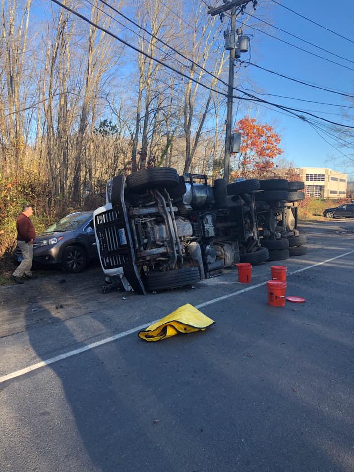 Monroe PD Minor injuries after dump truck rollover