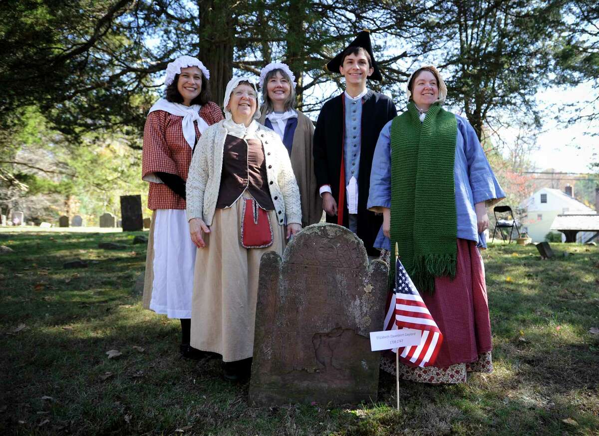 Volunteers to portrayed local residents gather for a photograph following the Spirits of the Past cemetery walk and re-enactment at Sharp Hill Cemetery in Wilton, Conn. on Nov. 2, 2019. The event attended by three dozen area residents and sponsored by the Wilton Historical Society and Wilton Congregational Church, Sharp Hill is the oldest surviving cemetery in Wilton, dating back to 1738 when John Marvin gave a small parcel of land to the Congregational Society of Wilton as a site for a meeting house.