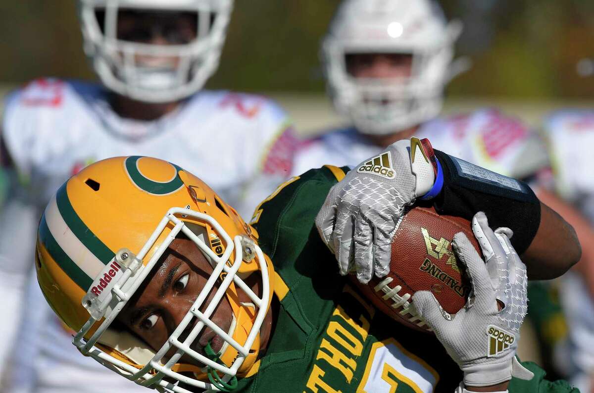 Trinity Catholic/Wright Tech’s Michael Barrett (2) scores against Greenwich in the first half of an FCIAC high school football game at Gaglio Field in Stamford, Conn. on Nov. 2, 2019. Greenwich won 49-8. The melding of the two schools together has brought about a bigger sense of brotherhood.
