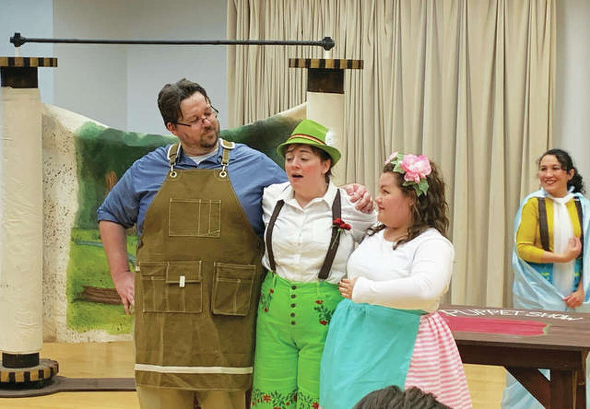 Left to right, first-year graduate students Evan Babel, tenor, as woodworker/clock-maker Geppetto, Stephanie Mossinghof, mezzo soprano, as Pinocchio, and SIUE student Cady Thomas, as Olympia, perform in a dress rehearsal of “Pinocchio: An Opera for Kids.”