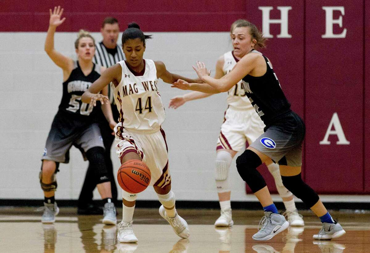 Magnolia West power forward Kamryn Jones (44) goes after a loose ball during the first quarter of a Region III-5A high school area basketball playoff game at Hearne High School, Friday, Feb. 15, 2019, in Hearne.