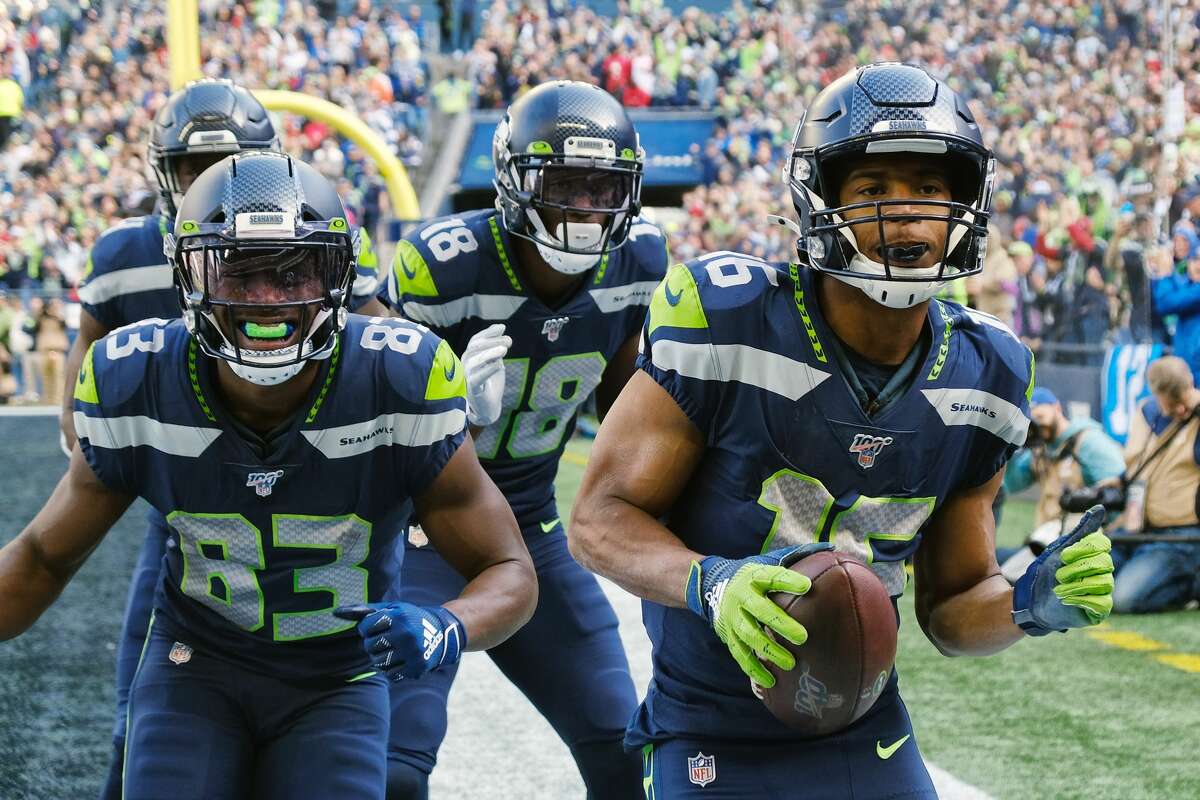 Seattle Seahawks wide receiver Tyler Lockett (16) celebrates for a touchdown in the first quarter of Seattle's game against Tampa Bay, Sunday, Nov. 3, 2019 at CenturyLink Field