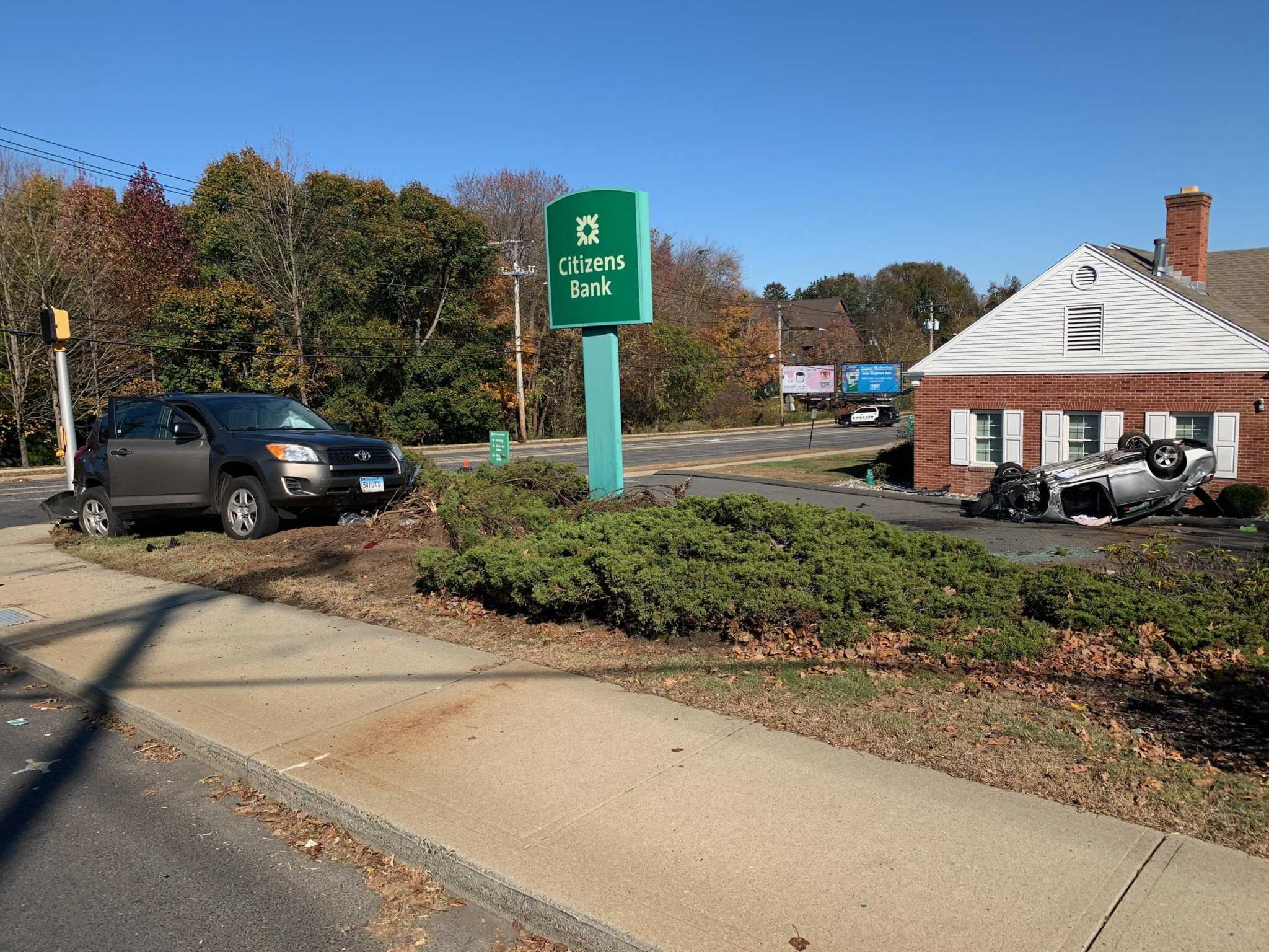 Car hits car, building in Milford