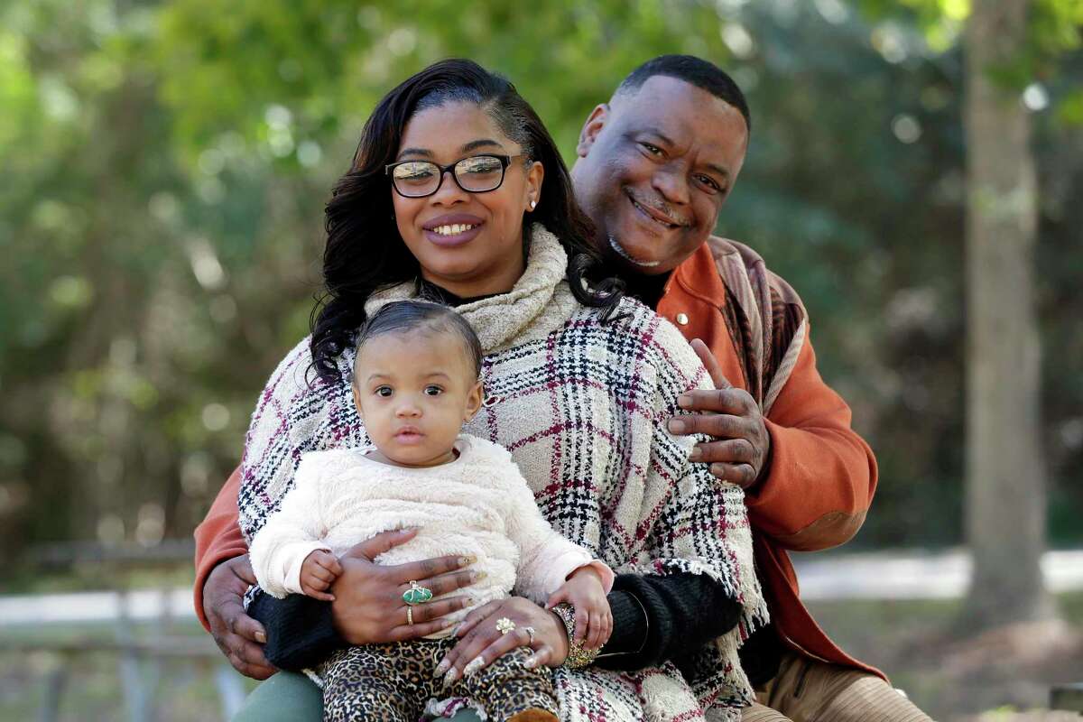 Genia Robinson, a victim of domestic abuse when she was pregnant with another man, with her husband Michael Mamou and one year old daughter Amia Estes at the Jesse Jones park Friday, Nov. 1, 2019 in Humble, TX.