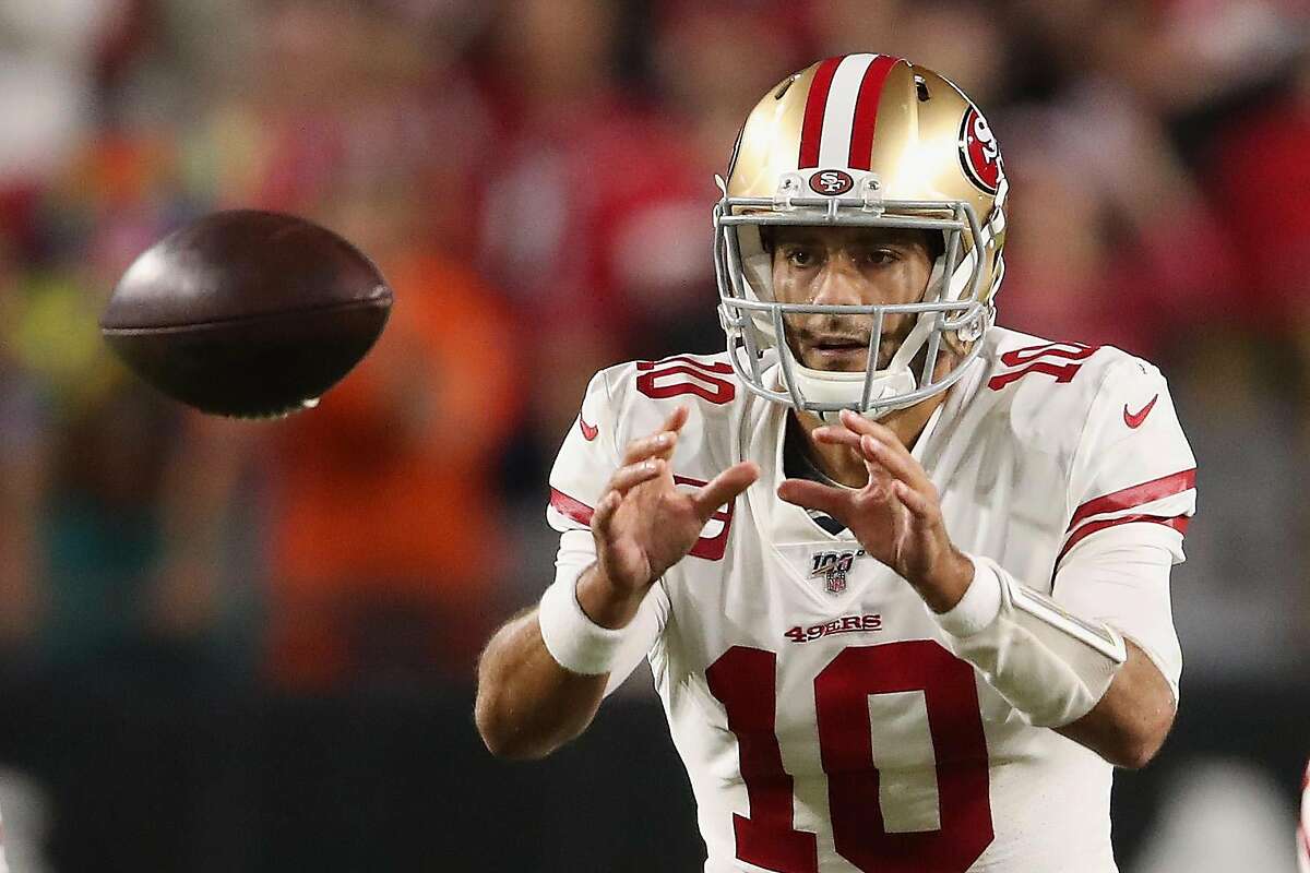 GLENDALE, ARIZONA - OCTOBER 31: Quarterback Jimmy Garoppolo #10 of the San Francisco 49ers catches the snap during the first half of the NFL game against the Arizona Cardinals at State Farm Stadium on October 31, 2019 in Glendale, Arizona. The 49ers defeated the Cardinals 28-25. (Photo by Christian Petersen/Getty Images)