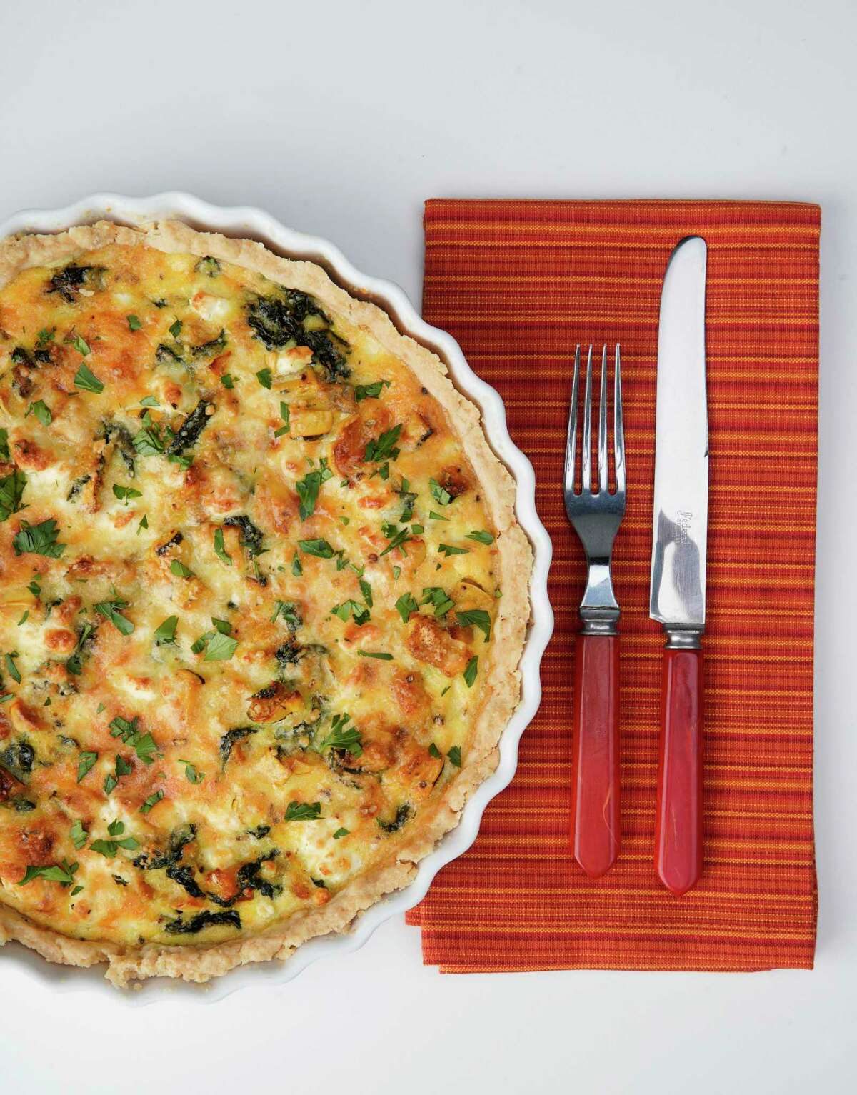 Spinach and roasted squash play starring roles in this simple quich that can be made with supermarket pie dough.