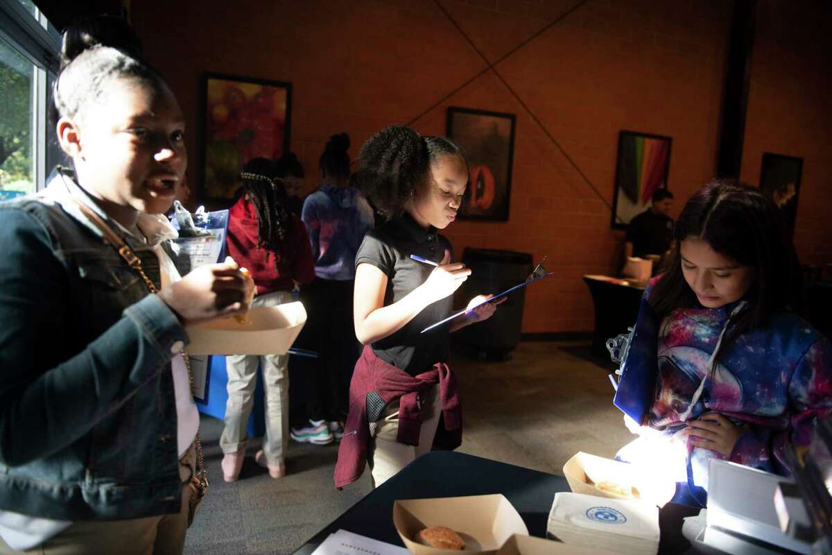 Martin Luther King Academy students Malaysia Jones,10, left, Simera Hamilton, 10, and Sophia Sophia Olvera, 10, taste and rate a pumpkin empanada at The Culinary Institute of America, to provide feedback to the San Antonio Independent School District Child Nutrition Services menu development during the fifth annual Food Extravaganza on Monday. The students were helping determine which of these potential dishes will be served at SAISD in the 2020-21 school year.