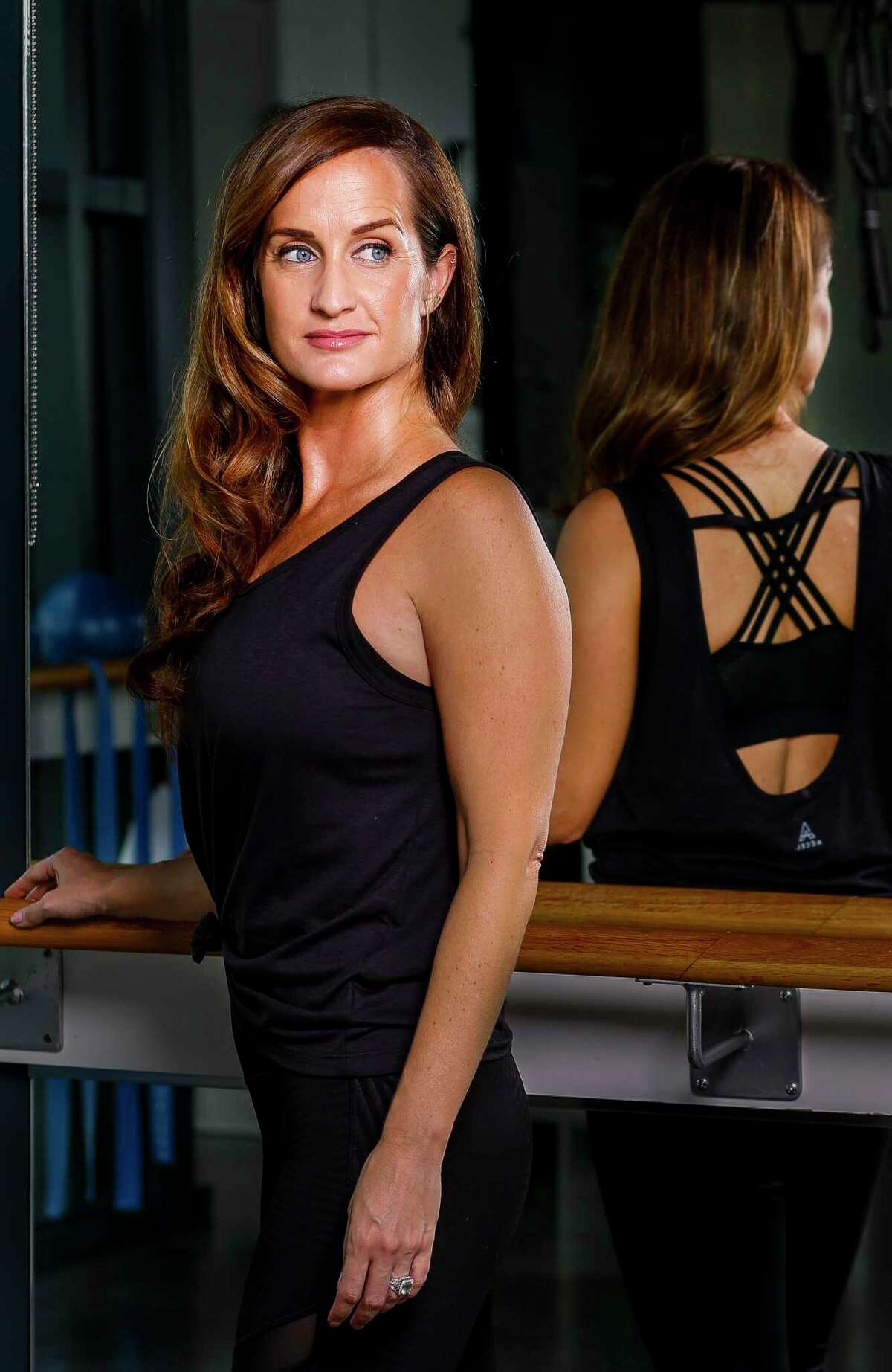 Megan Eddings, who founded Accel Lifestyle, a clothing company who developed what they call "anti-stink" fabric used in workout clothes, wears one of the company's women's tops at Define studio in the Heights in Houston, Monday, Sept. 30, 2019.