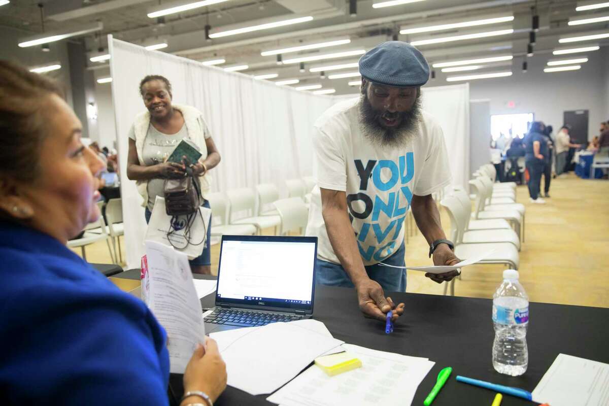 A Houston man participates in an event last winter to help people clear issues with unpaid tickets without fear of arrest. Many people who pose no threat to the community are jailed because they can’t afford to pay fines and fees.