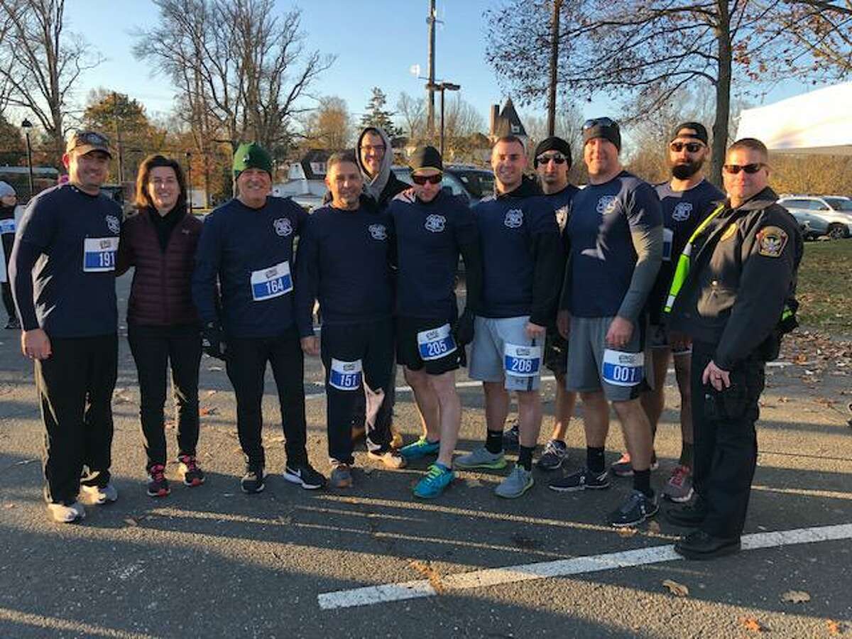 Women's Center Board Chair Glori Norwitt with members of the Cops & Robbers 5K