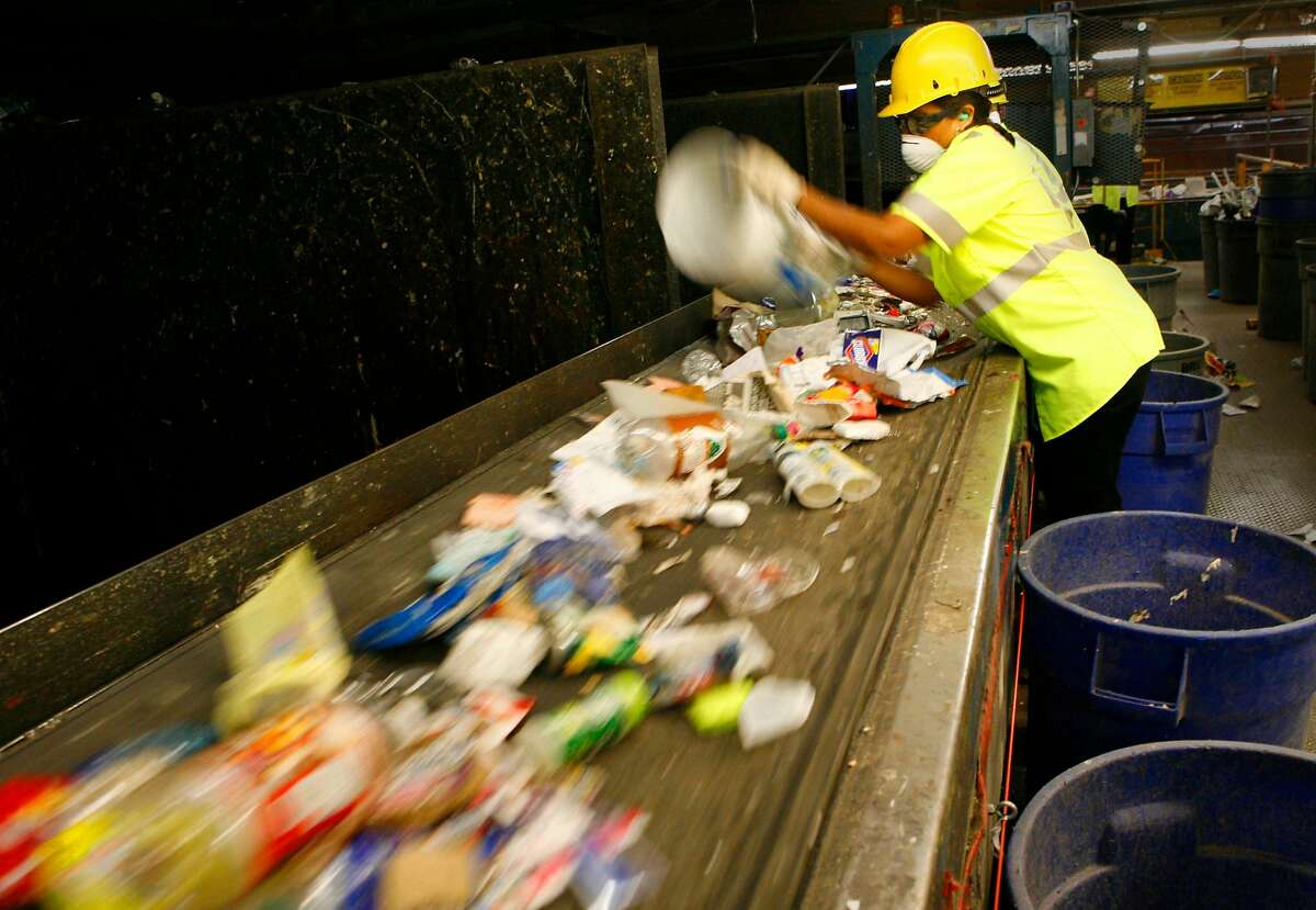 Various plastics are separated from other recyclables on a quick moving conveyor belt. California Waste Solutions, Inc., is a privately owned recycling and waste management company operating in the San Francisco Bay Area since 1990. The San Jose City Council recently awarded CWS the franchise to both collect and process the city's single-family curbside recycling set-outs. Photos taken on Tuesday, July 10, 2007 in San Jose, CA. Photo by Michael Maloney / San Francisco Chronicle *** Ran on: 07-20-2007 A worker sorts recyclable plastic at a California Waste Solutions Inc. facility in San Jose.