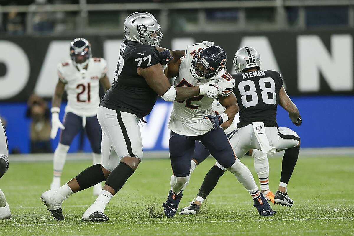 Chicago Bears outside linebacker Khalil Mack (52) is blocked by Oakland Raiders offensive tackle Trent Brown (77) during the second half of an NFL football game at Tottenham Hotspur Stadium, Sunday, Oct. 6, 2019, in London. (AP Photo/Tim Ireland)