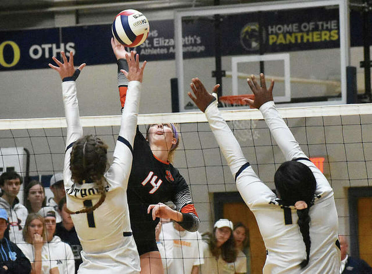 Edwardsville senior Maddie Isringhausen goes up for an attack in the first game against Althoff in the semifinals of the Class 4A O’Fallon Sectional.