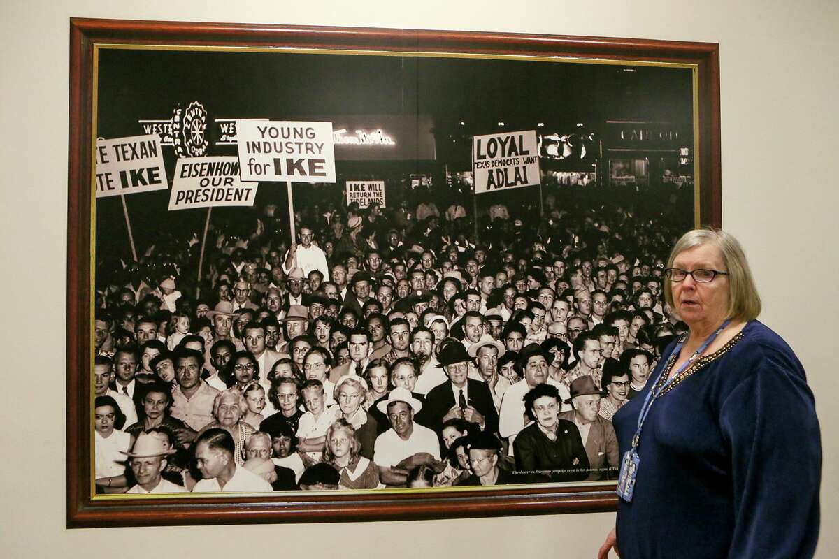 Bexar County Elections Administrator Jacque Callanen talks with reporters at the county’s Elections Department, 1103 S. Frio St. on Tuesday. In the background is one of several historic images that hang on the walls of the department.