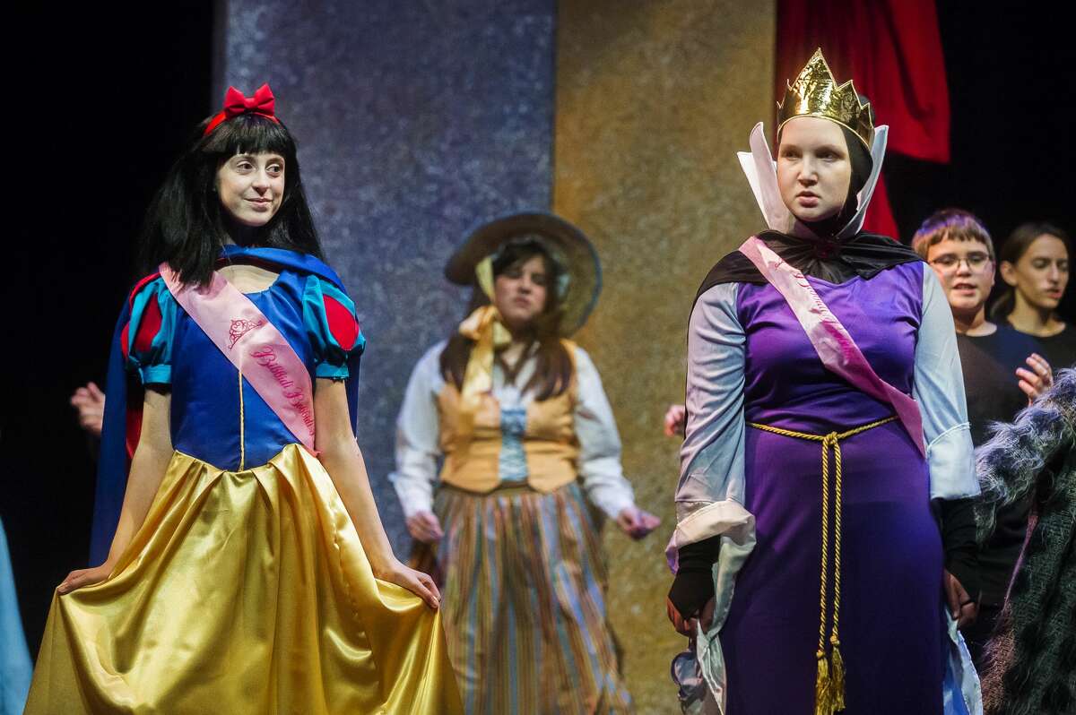 Maddie Snawder in the role of Snow White, left, and Davis Veith in the role of Evil Queen, right, act out a scene during a dress rehearsal for Center Stage Theatre's production of "Snow White Musicapalooza" Monday, Nov. 4, 2019 at Midland Center for the Arts. (Katy Kildee/kkildee@mdn.net)
