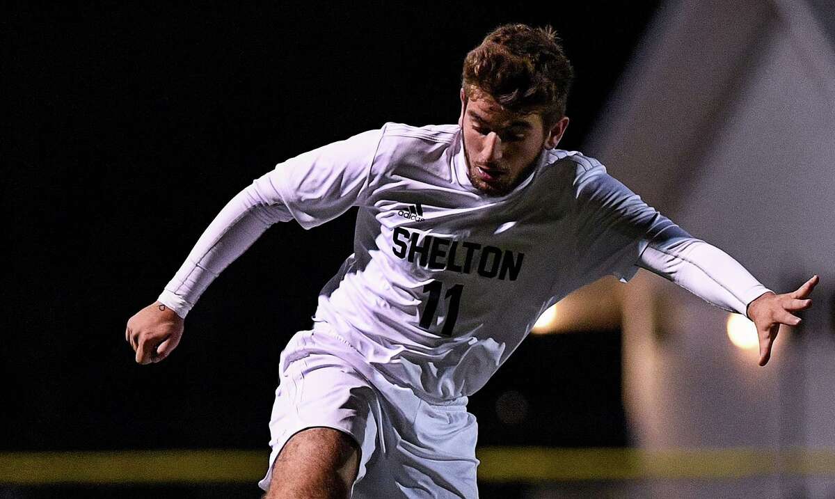 Vinny Mallozzi works the ball up field in the SCC semifinals. Daniel Hand defeated Shelton High in OT, 1-0, in an SCC semi-final match at the Surf Club in Madison, CT, Monday November 4, 2019.