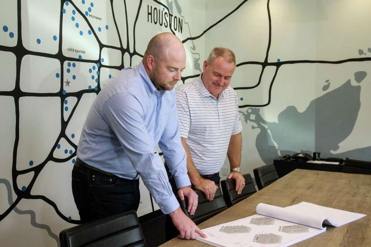 President Cullen Burton, left, and CEO Shawn McAlpin, of Burton Construction in a conference room with a map in the background showing the location of some of their projects in Houston. September 30, 2019.