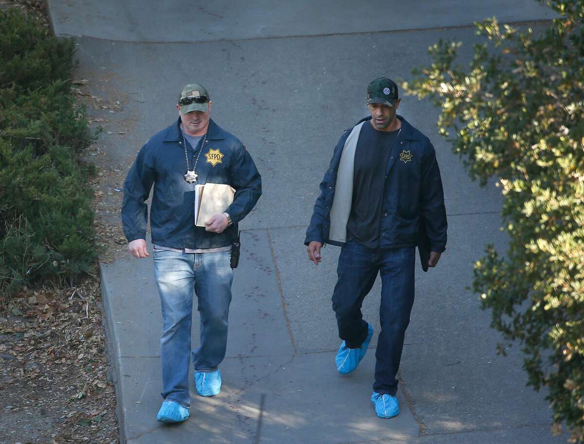 Officers from the San Francisco Police Department walk down Lucille Way in Orinda, Calif. on Friday, Nov. 1, 2019 after four people were killed and several left injured in a shooting during a Halloween party Thursday night.