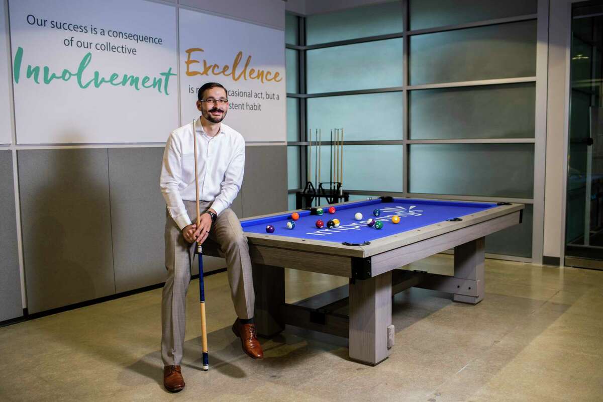 Improving — Houston president Devlin Liles inside the firm's office, Tuesday, Sept. 10, 2019, in Houston. After reaching their yearly goals, the company acquired a pool table.