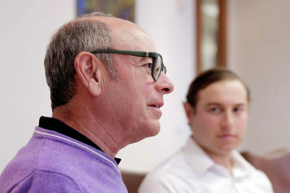 CEO Michael Morgan, left, and his son Philip Morgan, right, talk about the history, ethic, culture and direction of the Morgan Group, founded by Holocaust survivor Bill Morgan.